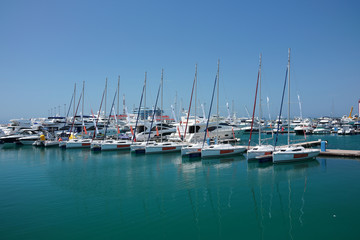 The marine jetty with yachts and boats