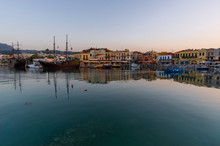 Greece, Crete Rethymno, Panoramic View Old Venetian Harbor At The Sunset.	
