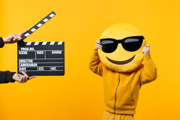 little kid boy 3-4 years old in yellow clothes isolated on orange wall background, children studio p