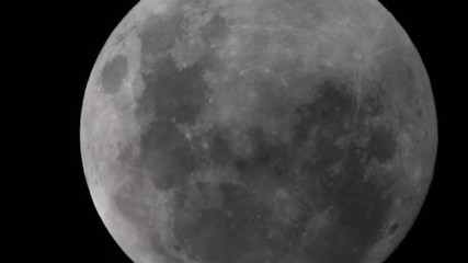 Wall Mural - little tour on the super moon in full phase, with also clouds pass through in the dark space, taken 