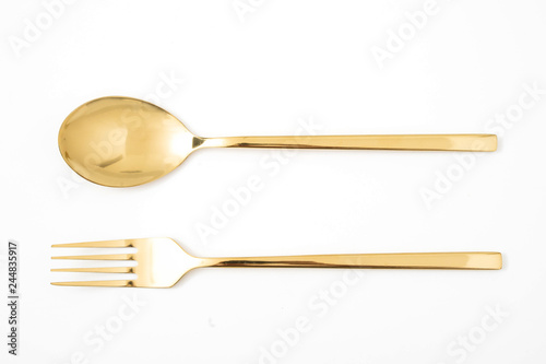 Cuadros en Lienzo golden spoon and fork isolated on a white
