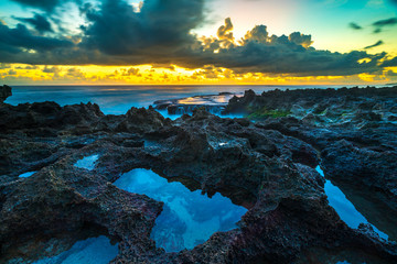 Wall Mural - Rock with sunset background.