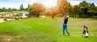 Panorama of Golfer hit sweeping golf ball on blurred  beautiful golf course with sunshine on background.