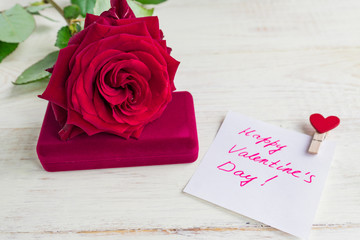 jewelry gift box and bautiful red rose on wooden background. Present for Valentine's day