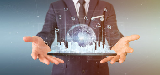 Poster - businessman holding smart city user interface with icon, stats and data 3d rendering