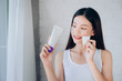 © Kiattisak - Young Beauty Asian Woman Cleaning Face with Cotton and Cleansing foam Skincare for Reduce acne problems Her Smile and Happy Morning in White Bedroom.
