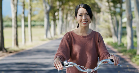 Sticker - Woman ride a bike in countryside