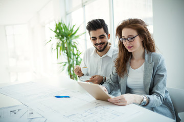 Business people working together on project and brainstorming in office