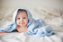 Cute Little Baby Boy, Relaxing In Bed After Bath, Smiling Happily
