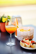 Italian aperitives/aperitif: glass of cocktail (sparkling wine with Aperol) and appetizer platter on the table