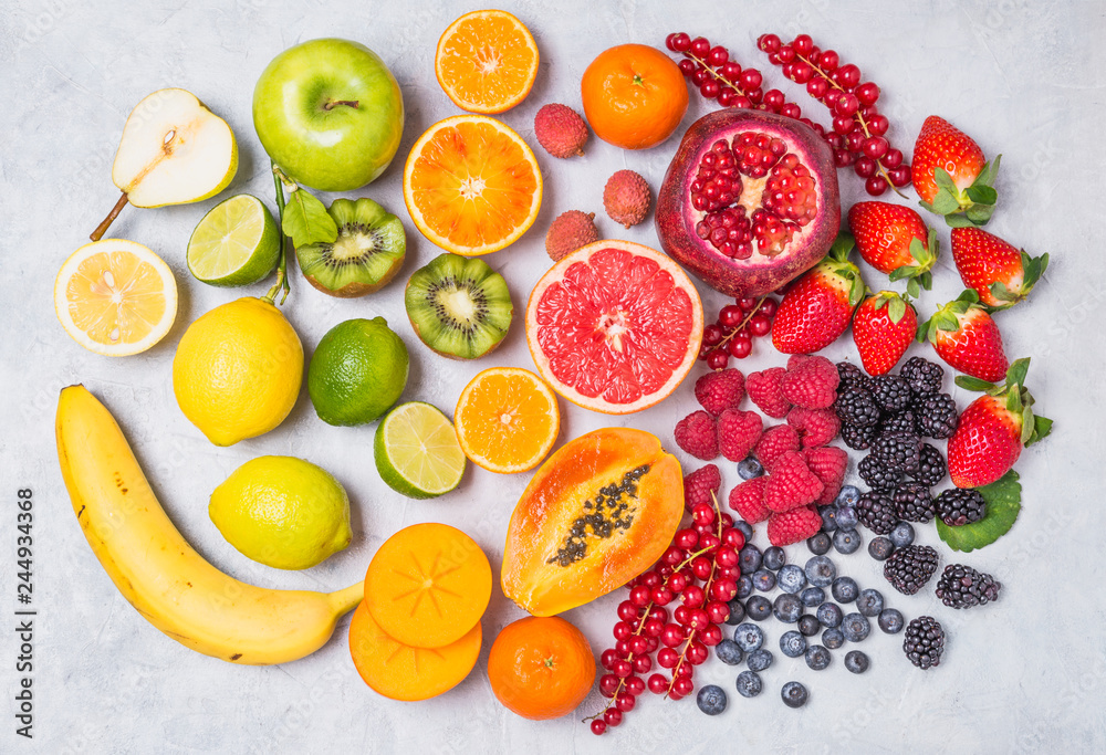 Fruits and berries rainbow top view.Natural vitamins and antioxidants food concept. - obrazy, fototapety, plakaty 