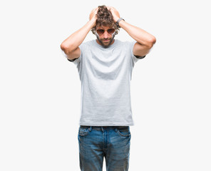 Canvas Print - Handsome hispanic model man wearing sunglasses over isolated background suffering from headache desperate and stressed because pain and migraine. Hands on head.