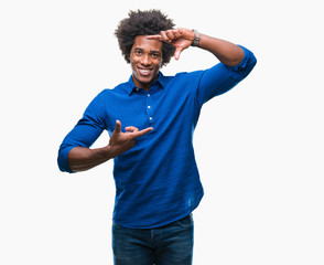 Afro american man over isolated background smiling making frame with hands and fingers with happy face. Creativity and photography concept.