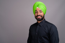 Young Indian Sikh Businessman Wearing Green Turban