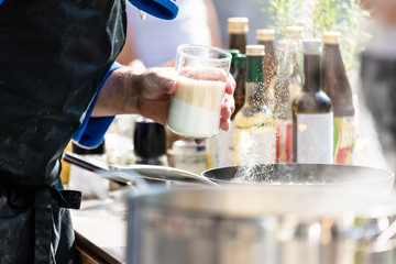 Chefs at work in a restaurant kitchen making delicious food