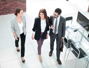 Canvas Print - in full growth.employees of the company talking in the office