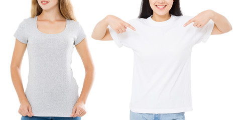Wall Mural - Women asian and caucasian in blank template t shirt isolated on white background. Girlsl in tshirts with copy space and mock up for advertising. White and gray shirts. Front view