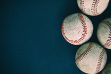 Old Rugged Group Of Baseballs On Black Background .  Baseball Sports Graphic With Copy Space.