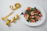 Fototapeta Lawenda - Fresh salad plate with shrimp, tomato and mixed greens. Healthy food. Clean eating.