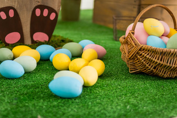 Easter eggs on meadow grass background Easter concept. painted Easter eggs in basket. spring holiday. Springtime decoration. Colorful Easter eggs