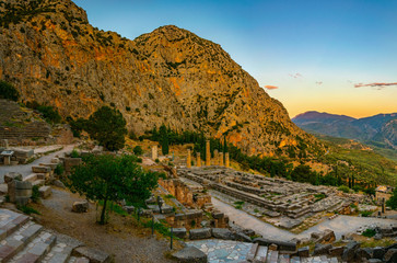 Sunset view of ruins of temple of Apollo at ancient Delphi, Greece