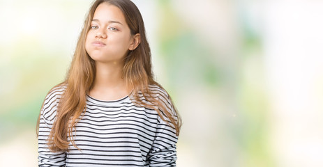 Sticker - Young beautiful brunette woman wearing stripes sweater over isolated background puffing cheeks with funny face. Mouth inflated with air, crazy expression.