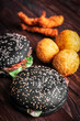 © jalisko - Black hamburger, fast food on wooden background, vertical frame