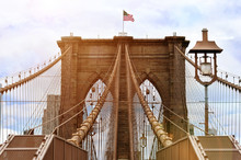 Brooklyn Bridge With United States Flag On Top