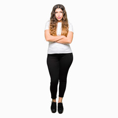 Sticker - Young beautiful woman wearing casual white t-shirt skeptic and nervous, disapproving expression on face with crossed arms. Negative person.