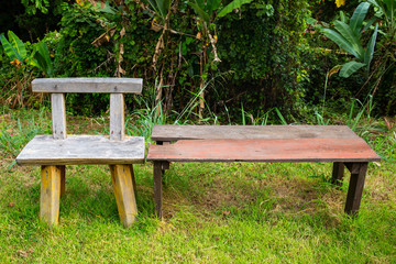 Handmade wooden chair on the grass texture background