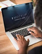 © Rawpixel.com - Woman working on a laptop screen mockup