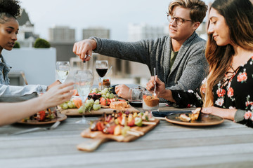 Friends enjoying at a rooftop party