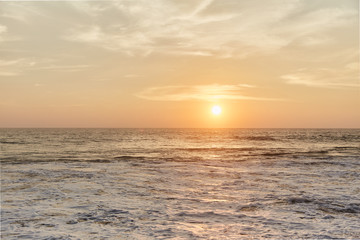 Wall Mural - Narigama Beach. Stunning sunset on the beach overlooking the ocean and the waves.  