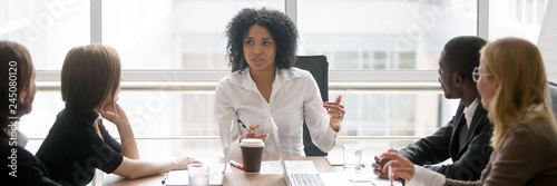 Fotografía Horizontal photo people sitting at boardroom african business woman talking with