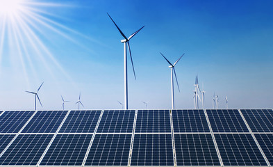Wall Mural - concept clean energy power in nature. solar panel with wind turbine and blue sky background