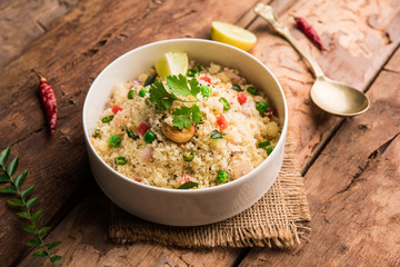 Rava Upma / Uppuma - south indian breakfast served in a bowl. selective focus