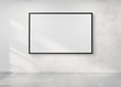 © sdecoret - Black frame hanging on a wall mockup 3d rendering