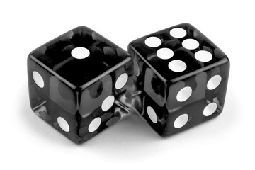 Two black glass dice isolated on white background. One and six