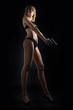© sanmartial - young woman in sexy lingerie with a gun