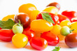 Mixed tomatoes of different colors. Red, yellow and brown tomatoes isolated on white