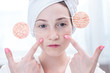 © Artem - Young woman looking at dry skin with cracks and with wrinkles. Circles increase the skin like a magnifying magnifier