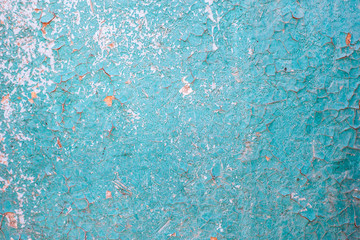 cracked blue paint on a wooden surface