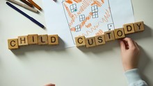 Kid Putting Child Custody Phrase And Heart On House Picture, Holding Hands