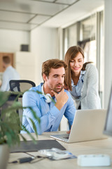 Two people in start up office, working together 