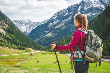 Wall Mural - young woman hiking in the mountains