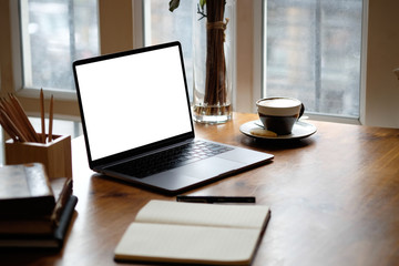 Fototapete - Mockup laptop computer on wooden table.