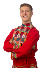 Wall Mural - Portrait of the attractive russian guy in red folk costume isolated on white