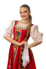 Wall Mural - Beautiful smiling caucasian girl in russian folk costume isolated on white