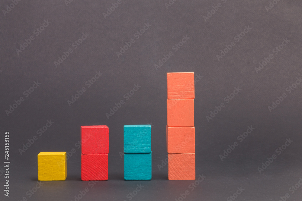Toy wooden blocks as financial graph. Graph with four 4 steps. Growing ...