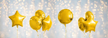 Holidays And Birthday Party Decoration Concept - Many Metallic Gold Helium Balloons Of Different Shapes Over White Background